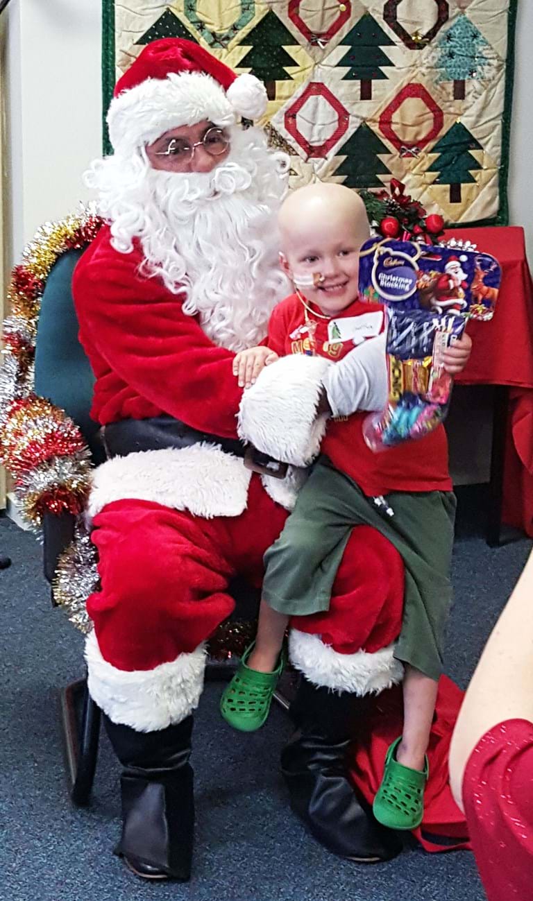 Young cancer patient Daniel meets Santa at Fight Cancer Foundation's Christmas party
