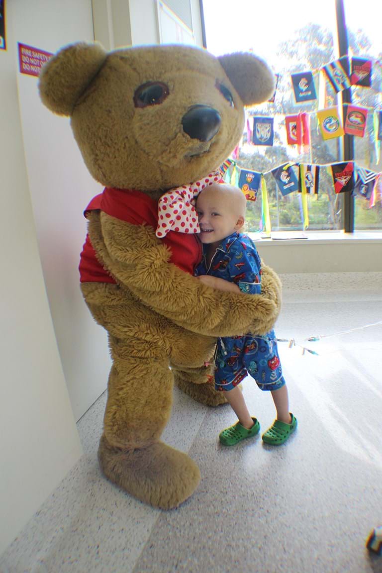 Young cancer patient Daniel with Fight Cancer Foundation's Bo Bear